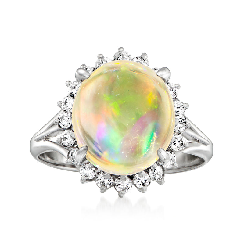 Platinum opal and diamond halo ring with round rainbow opal center