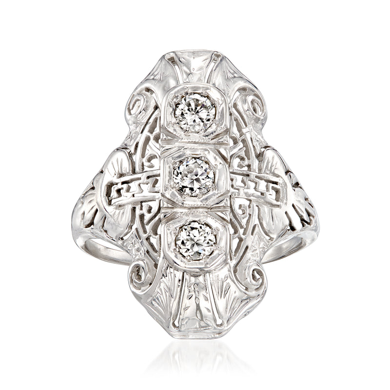 Vintage white gold diamond filigree ring with three round stones in a shield setting