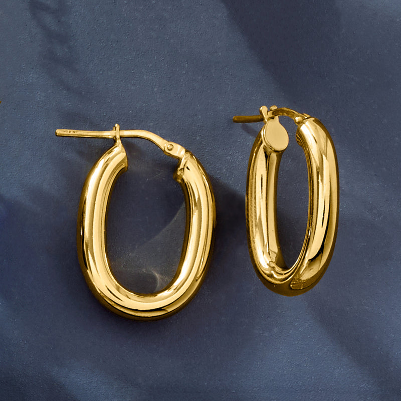 Gold oval hoop earrings, polished oval shape with post-style hinge