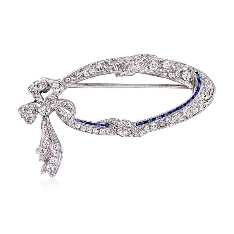 Vintage diamond and blue sapphire bow pin in platinum setting, marquise details