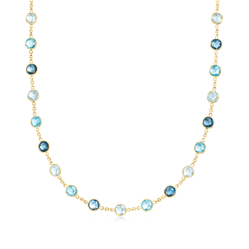 14kt yellow gold station necklace with oval blue topaz gemstones, linked stations
