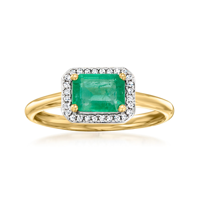 18kt yellow gold emerald-cut emerald ring with diamond halo and side stones