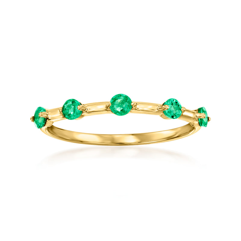 14kt yellow gold station ring with four round green gemstones