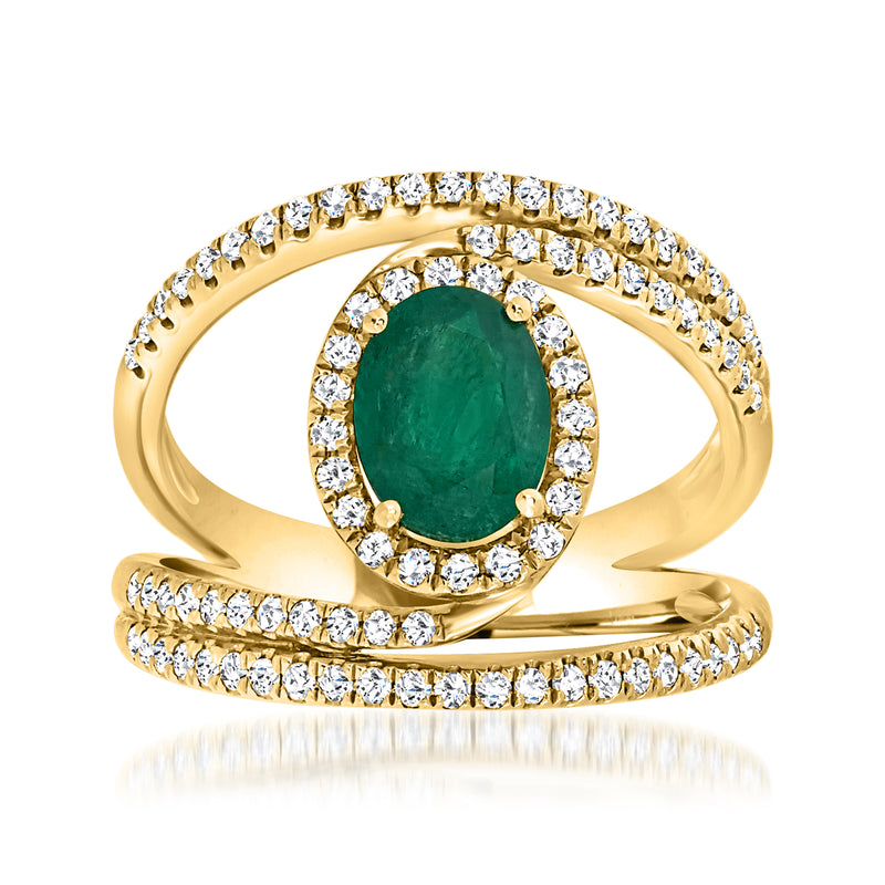 Yellow gold emerald ring with oval center stone and diamond swirl band