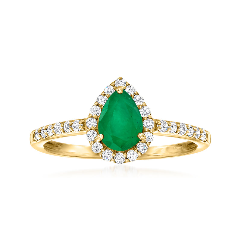 18k gold ring with oval emerald center and diamond halo and side stones