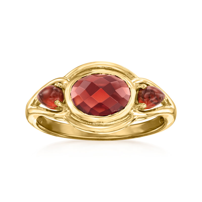 18kt gold over sterling garnet ring with oval red gemstone and three-stone sides
