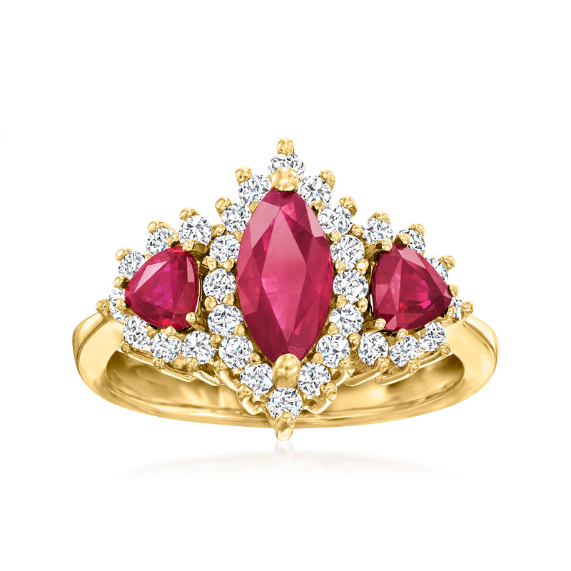 Oval ruby center ring with oval ruby side stones and diamond halo, 14kt yellow gold