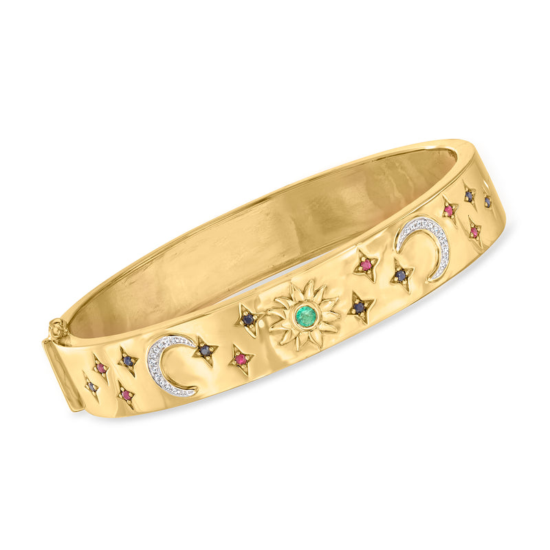 Gold-tone bangle with crescent moon and star details, featuring a green center stone