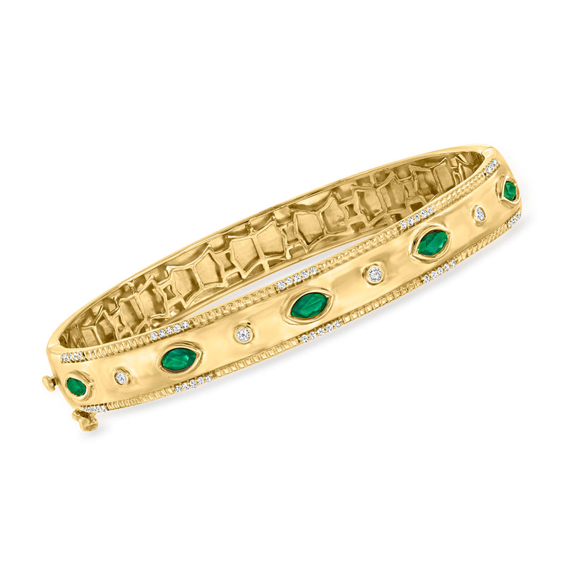 Gold-tone bangle with green oval stones, round crystals, and textured border detail