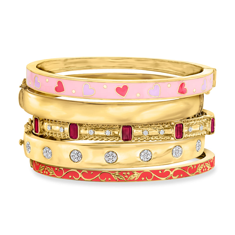 Five gold-tone bangle bracelets with enamel hearts in pink and red, plus crystal accents