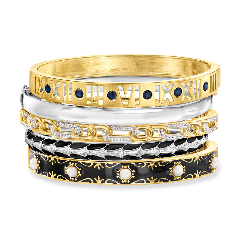 Five two-tone sterling silver bangles with Roman numerals, blue stones and enamel