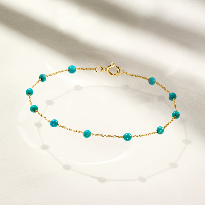 Turquoise round bead bracelet on 14kt yellow gold chain with spring-ring clasp
