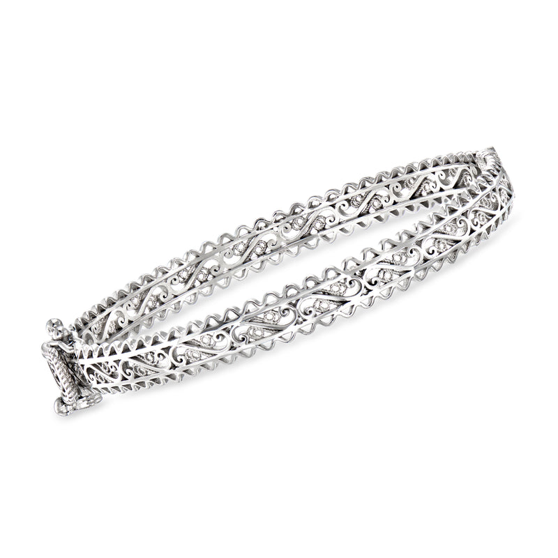 Sterling silver filigree bangle bracelet with openwork scroll pattern and hinged clasp