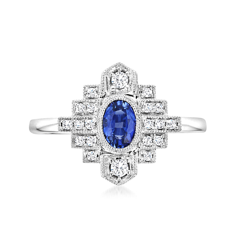 14kt white gold vintage ring with oval blue sapphire and diamond halo