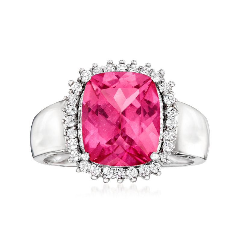 Sterling silver ring with large pink topaz center and white stone halo