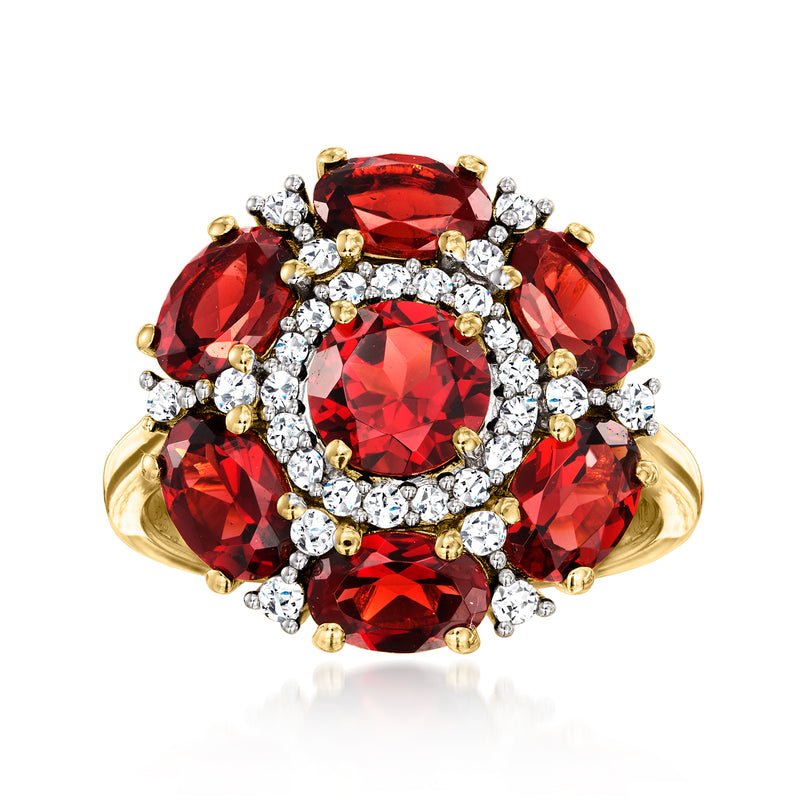 Floral garnet and diamond ring in gold-tone with red oval center and crystal accents