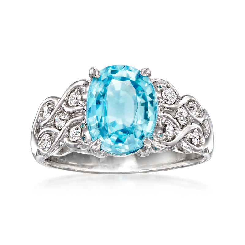Vintage white gold ring with oval blue zircon center and diamond accents