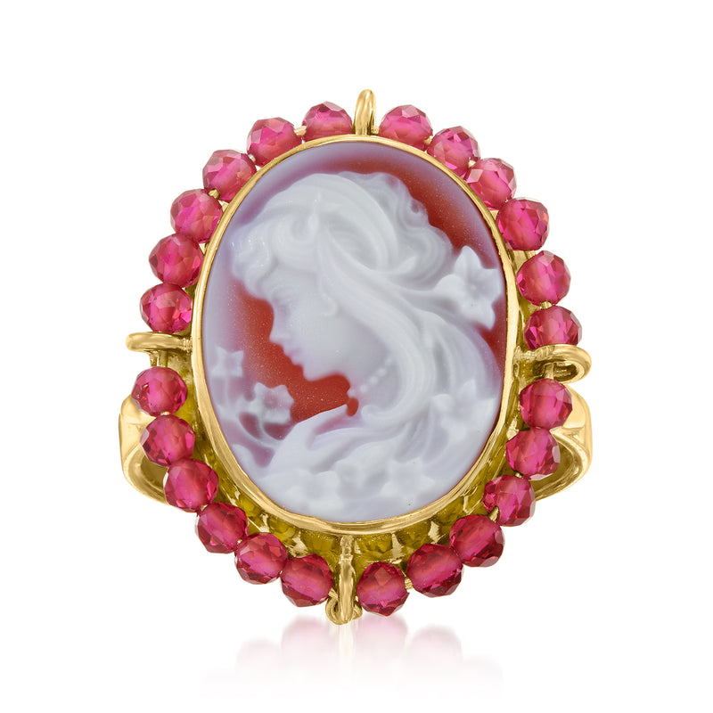 Gold oval cameo ring: white profile on red-orange stone, pink gemstone halo