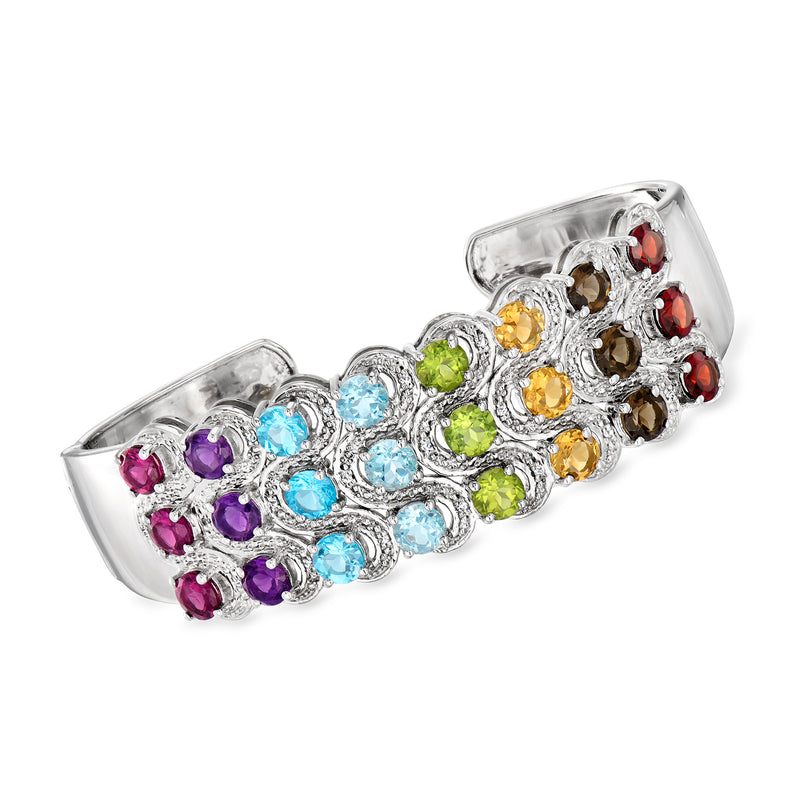 Sterling silver cuff bracelet with multicolor gemstone clusters in blue, green, yellow, purple, red.