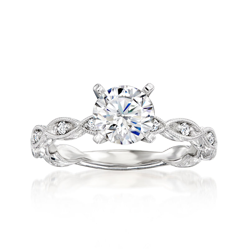 Diamond engagement ring setting in 14kt white gold with round center stone and scrollwork band