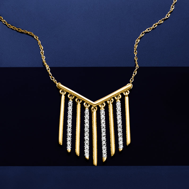 Gold chevron dangle necklace with vertical stone fringe and V-shaped pendant
