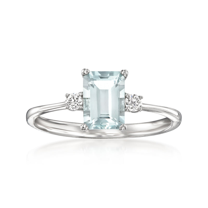 18kt white gold ring with emerald-cut aquamarine center and diamond side accents