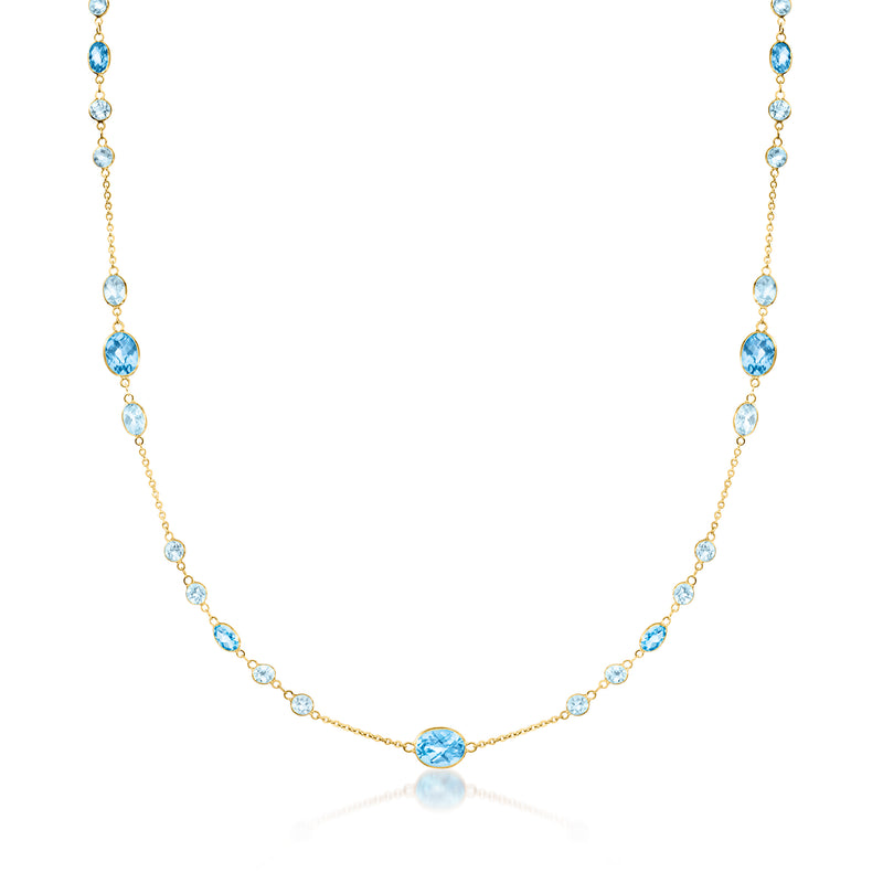 14kt yellow gold necklace with oval Swiss and sky blue topaz gemstones