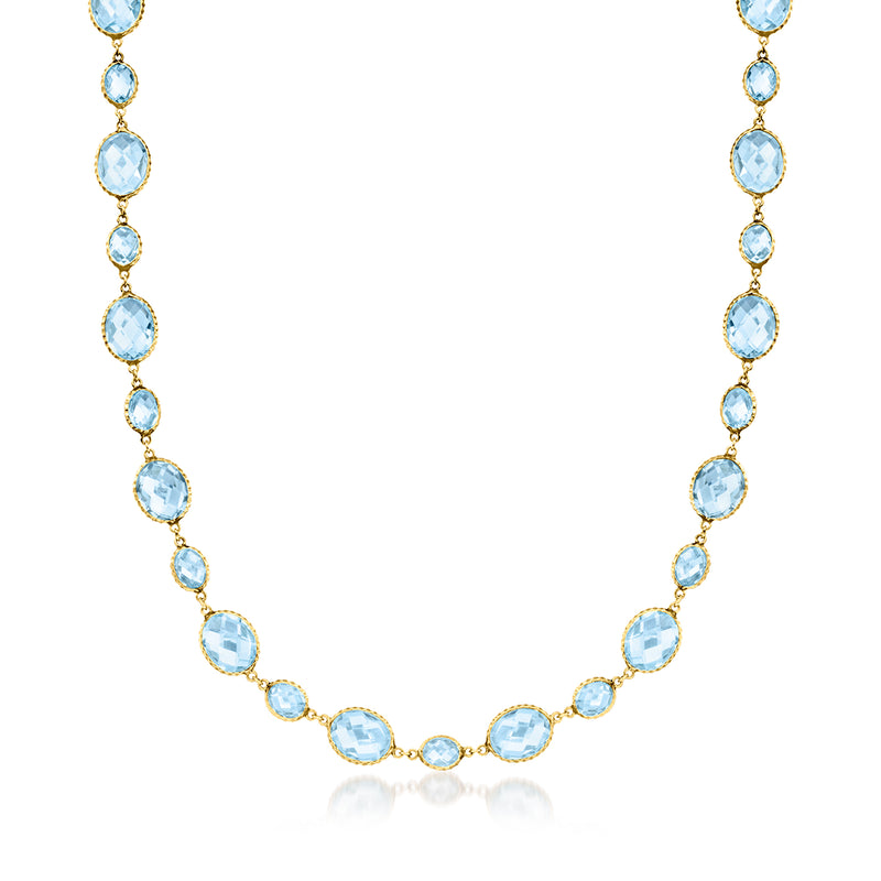 14kt yellow gold station necklace with oval sky blue topaz gemstones