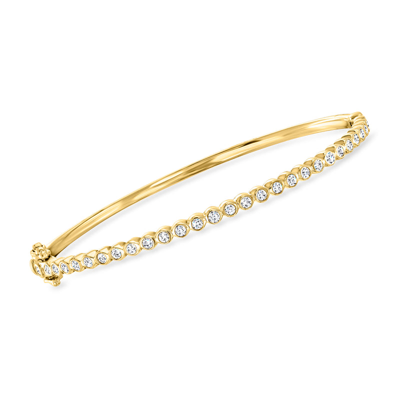 18kt yellow gold bangle bracelet with bezel-set round diamonds across the top, hinge clasp