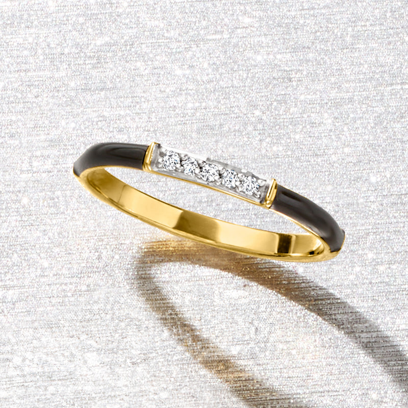 Gold-tone ring with black enamel sides and rectangular diamond row