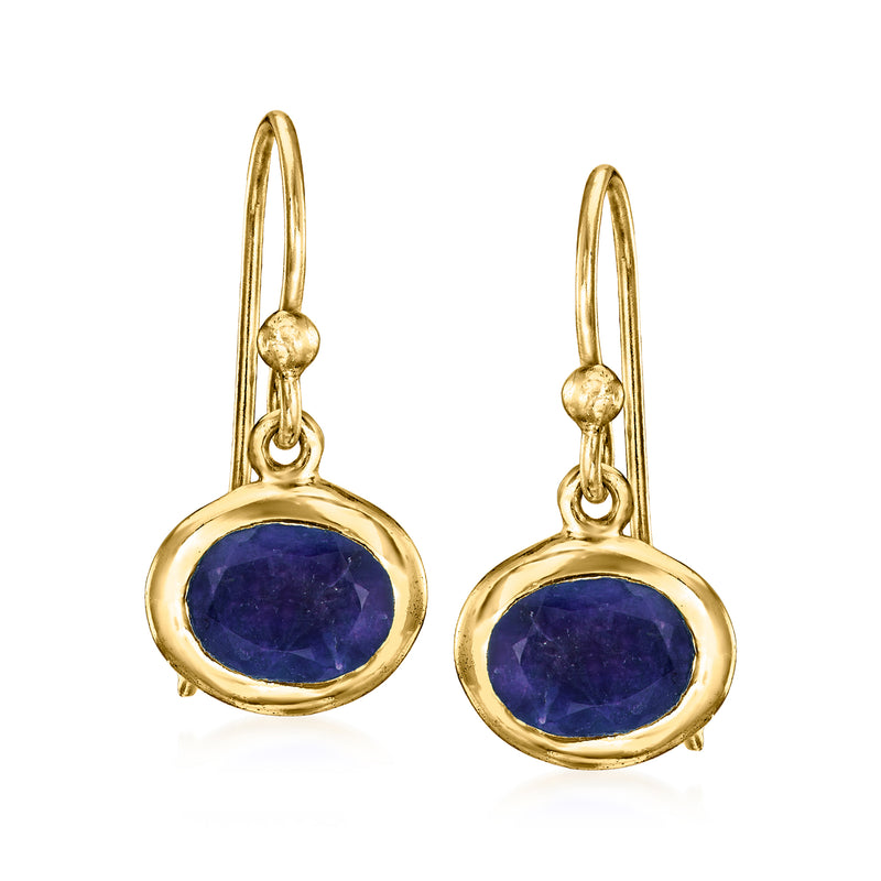 Gold over sterling drop earrings with oval deep blue gemstone, round bezel setting.