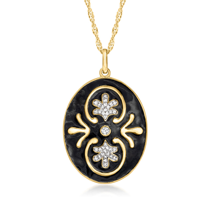 Gold-tone oval pendant necklace with black enamel and crystal floral motifs