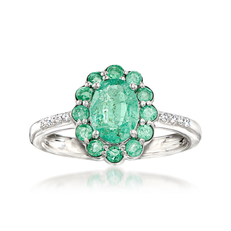 Sterling silver ring with emerald-cut green gemstone center and round emerald accents