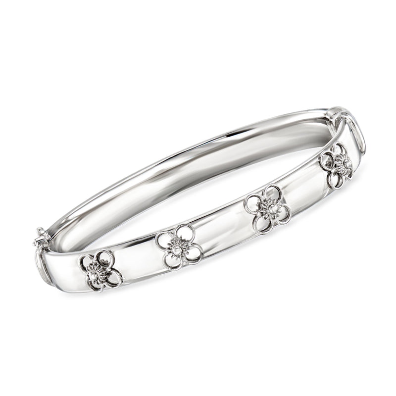 Sterling silver floral bangle bracelet with hinged clasp and four flower charms