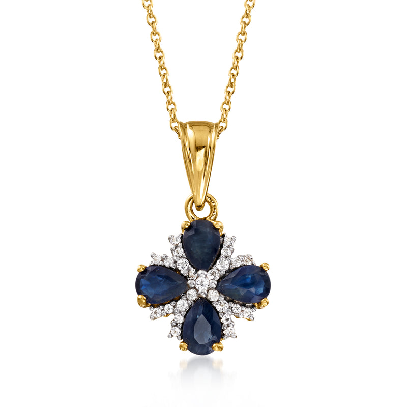 Gold flower pendant necklace with blue sapphire teardrop stones and white topaz accents