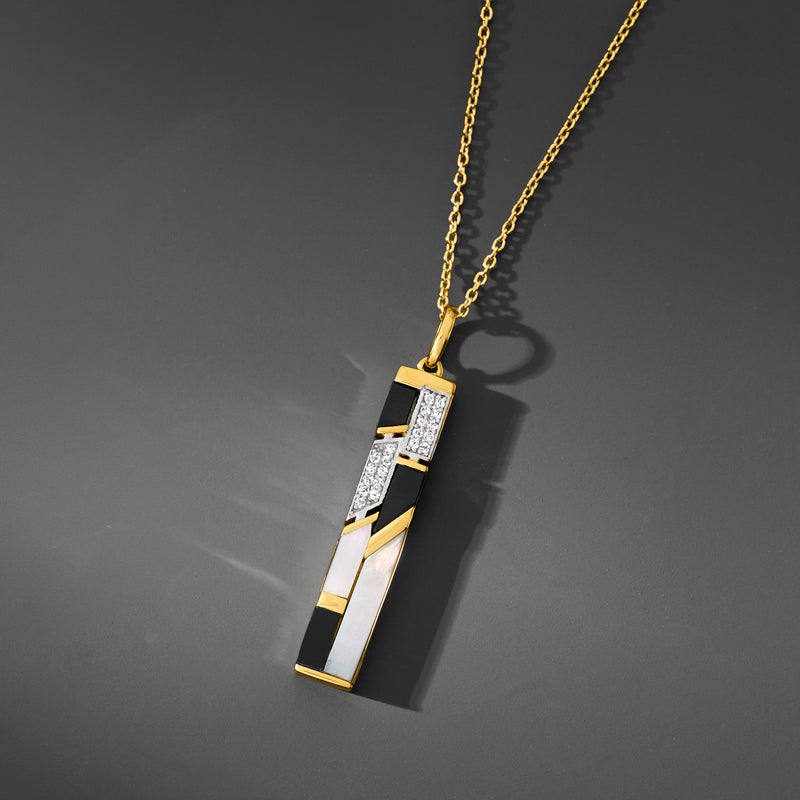 Gold pendant necklace with mother-of-pearl and onyx rectangle pendant on chain