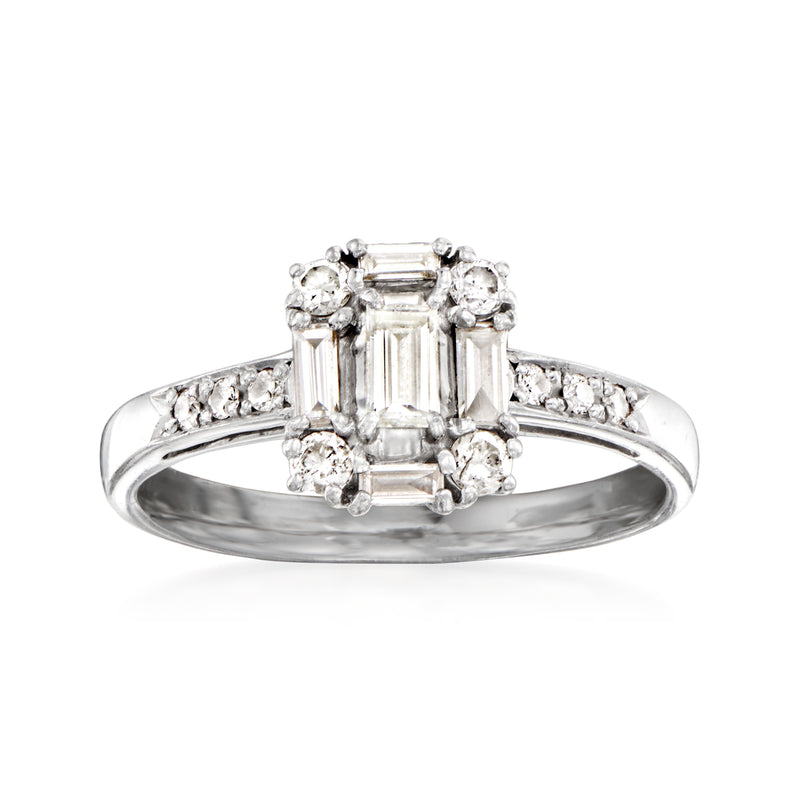 Platinum diamond ring with emerald-cut center and round halo stones on a slim band