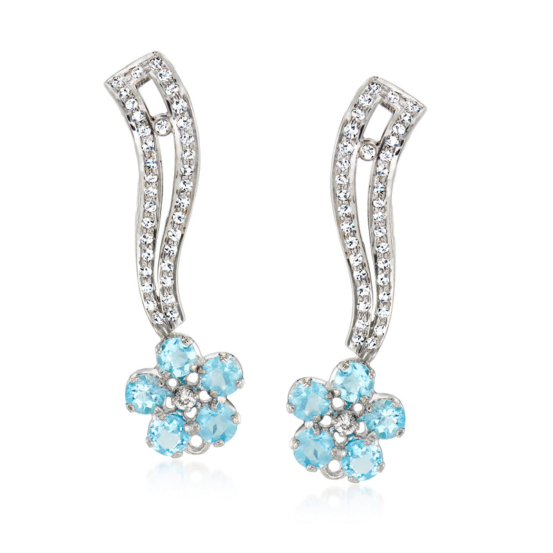 Diamond and blue topaz flower drop earrings in 18k white gold