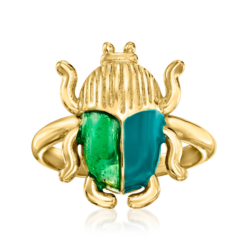 Gold-tone scarab ring with glossy green enamel, raised head and wing details.