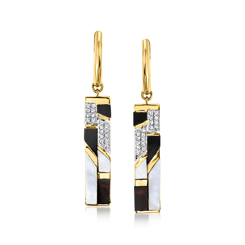 Gold drop earrings with rectangular black, white, and gold striped design and sparkle insets