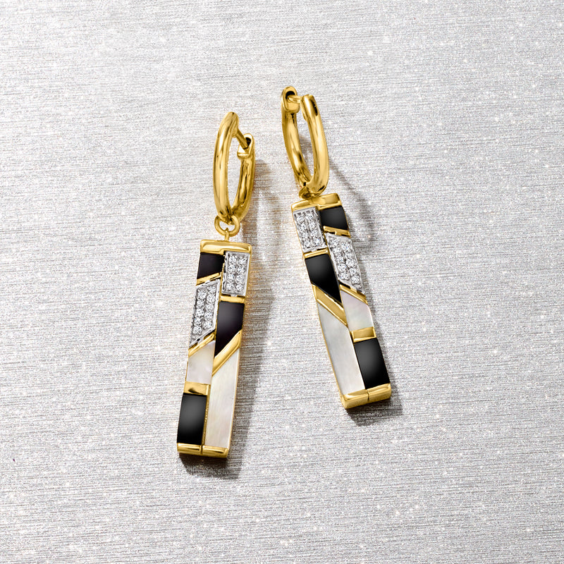 Gold drop earrings with hoop tops and black, white, and gold checker stripe dangles