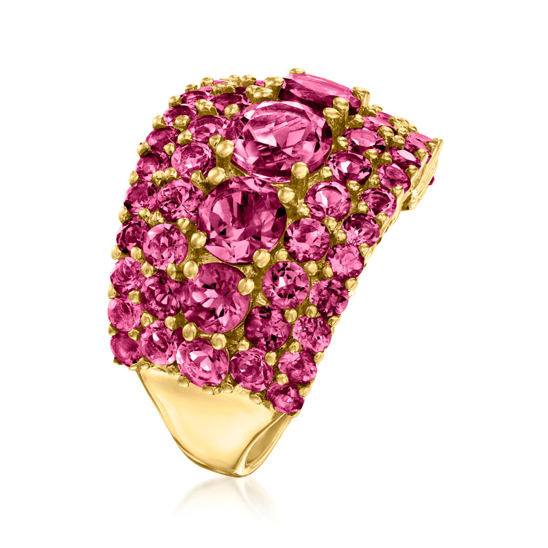 Pink gemstone cluster ring with large center oval and gold prongs, open side