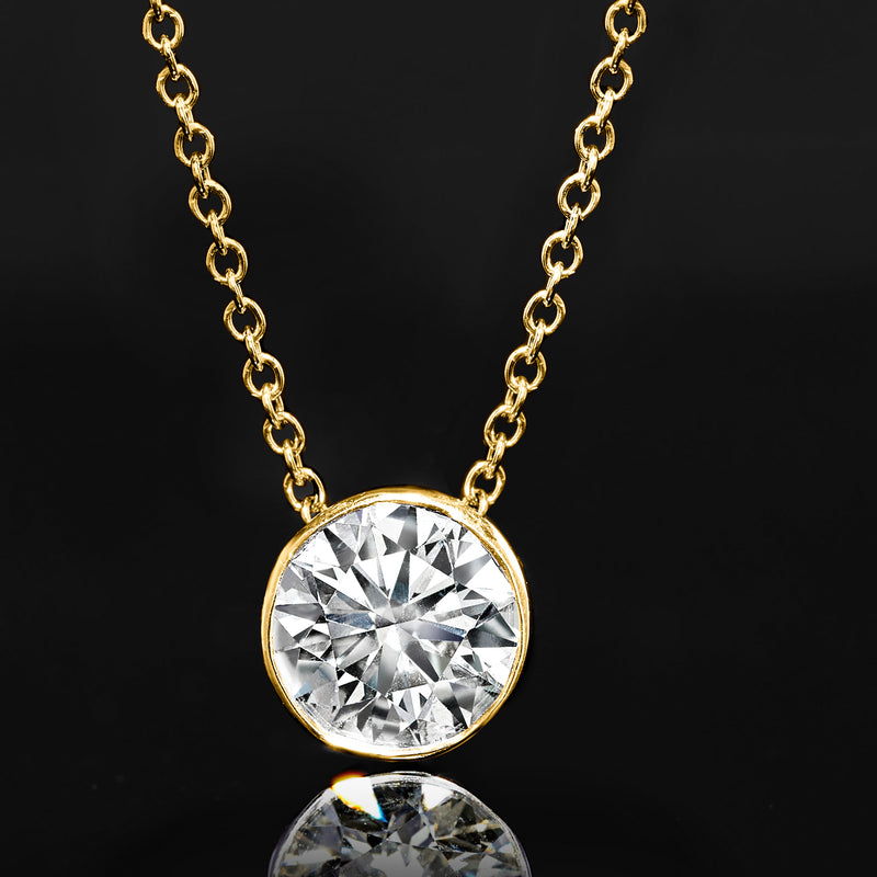 14kt yellow gold cable chain with round bezel-set diamond pendant