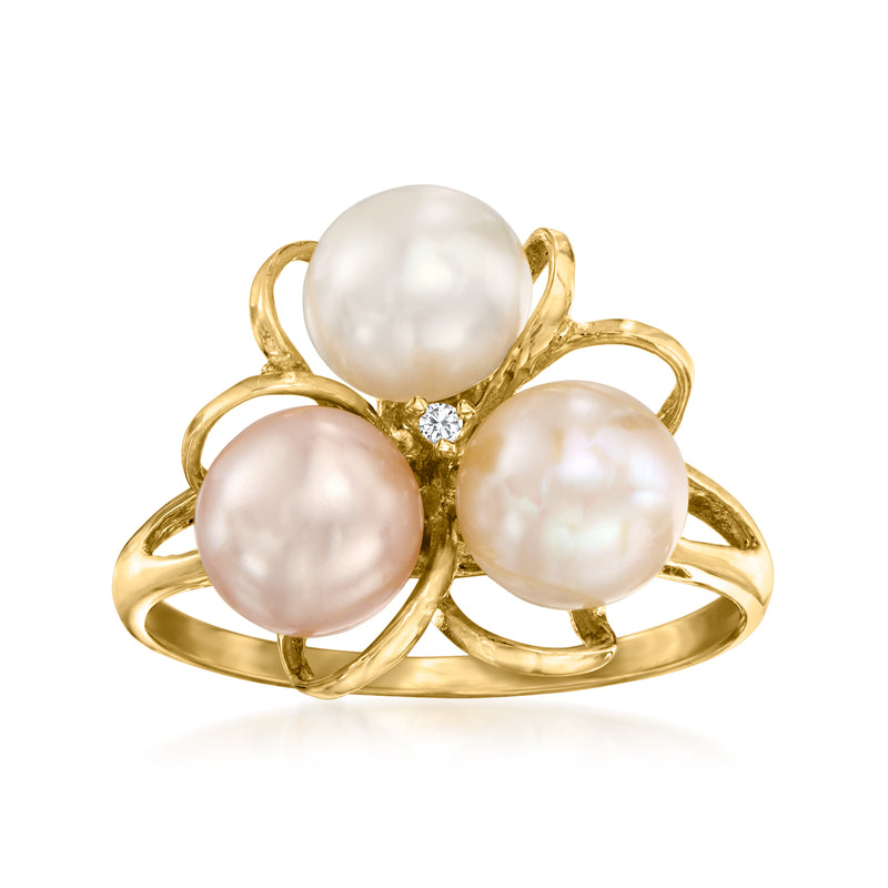 Gold flower ring with three white cultured pearls and a small diamond center detail