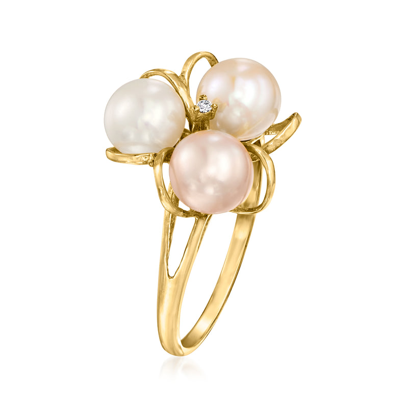 Gold three-pearl flower ring with center diamond, side view
