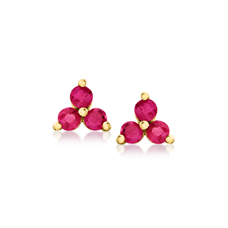 Three-stone ruby stud earrings in 14kt yellow gold, pair with rounded red gems.