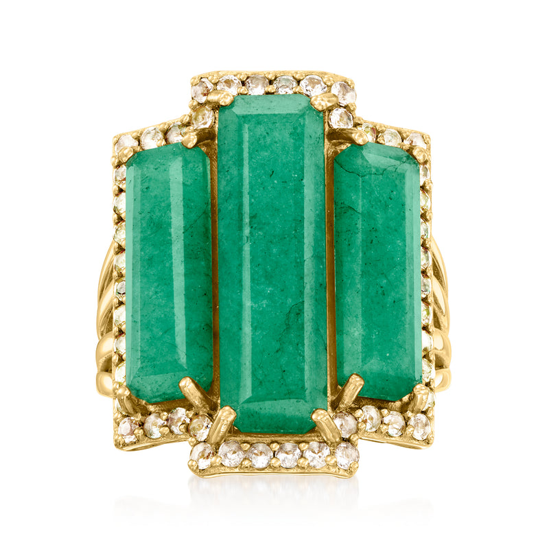Emerald-cut green gemstone ring with diamond-like accents in gold-tone setting