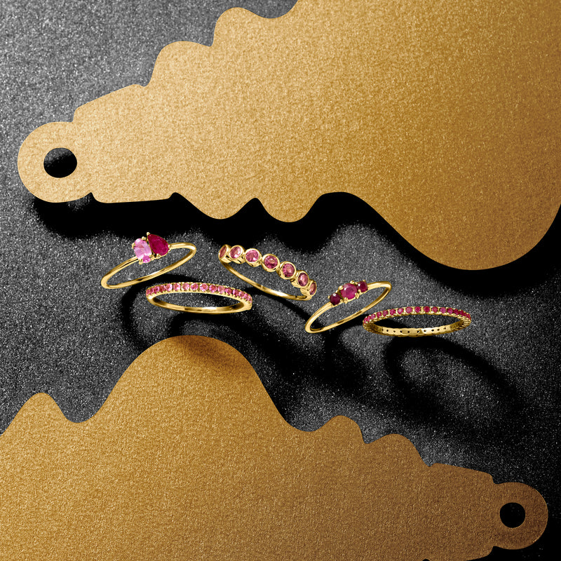 Yellow gold pink tourmaline bezel ring set with oval stones