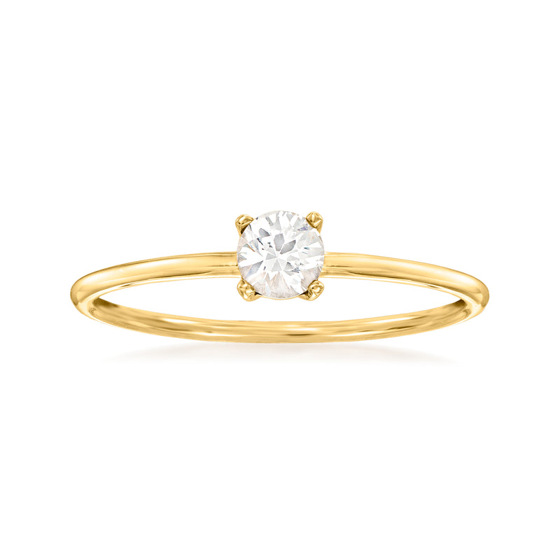 14kt yellow gold ring with white sapphire centerpiece in four-prong setting
