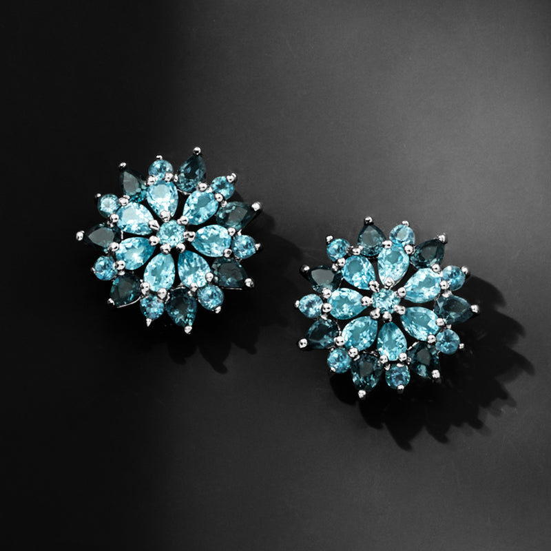 Sterling silver stud earrings with blue floral clusters and round center stone